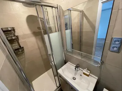 a bathroom with a sink and a shower with a mirror at Nice Renting - JAURES - Cosy Flat - Nice old town - Great view - AirCon in Nice