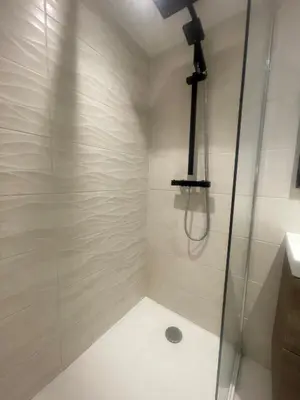 a bathroom with a shower with a glass door at Garibaldi 11 in Nice