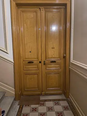 a wooden cabinet in the corner of a room at Nice Centre: à 300m de la mer et de la Promenade des Anglais in Nice