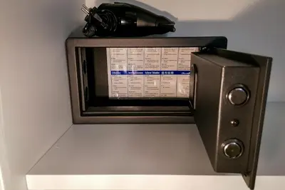 a microwave oven sitting on top of a shelf at Hotel Aparthotel AMMI Vieux Nice in Nice
