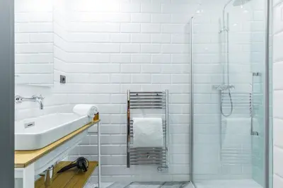 a white bathroom with a sink and a shower at FEEL HOME - BUNICO in Nice