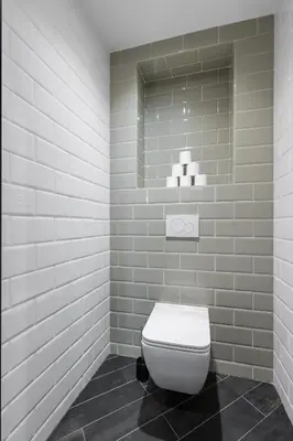 a bathroom with a white toilet and a mirror at FEEL HOME - BUNICO in Nice