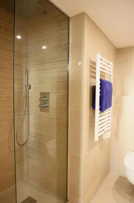 a bathroom with a glass shower with a toilet at Alexandre Mari old town few meters to the beach in Nice