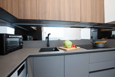 a kitchen with a sink and a counter top at Le Magenta - Happy Rentals in Nice