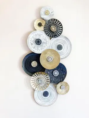 a group of different colored plates on a wall at Résidence Le Castille in Nice
