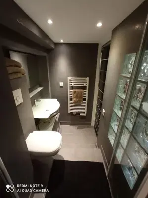 a bathroom with a white toilet and a sink at Charming and Modern Cave in the Heart of the Port in Nice