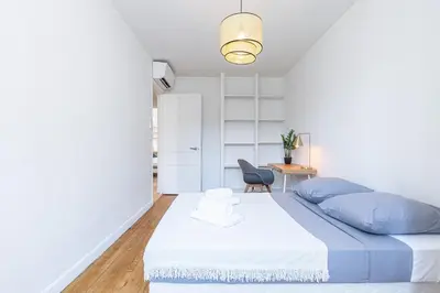 a bedroom with a blue and white bed and a desk at FEEL HOME - ALPHONSE KARR in Nice