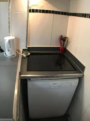 a kitchen with a sink and a counter top at Cosy sweet space in paradise - 5min from the beach in Nice