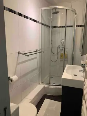 a bathroom with a shower and a toilet and a sink at Cosy sweet space in paradise - 5min from the beach in Nice