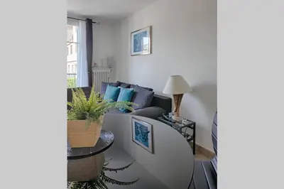 a living room with a couch and a table at Charme et Confort pour vos vacances sur Nice in Nice