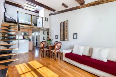 a living room with a couch and a table at Samourai Massena Lodge -1 min from the sea in Nice