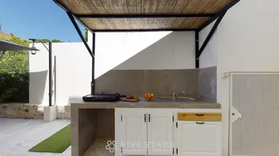 a kitchen with a sink and a counter top at Villa Capriciosa - Five Stars Holiday House in Beaulieu-sur-Mer