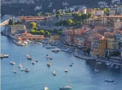 a group of boats in the water in a harbor at La NONETE in Villefranche-sur-Mer