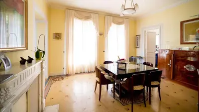 a kitchen with a table and chairs in a room at La NONETE in Villefranche-sur-Mer