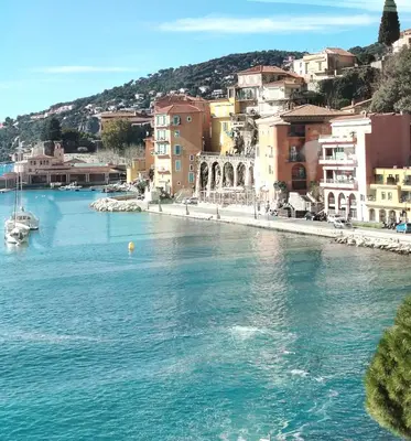 a view of a river in a city with buildings at 35m2, luminous loft close to the beach in Villefranche-sur-Mer