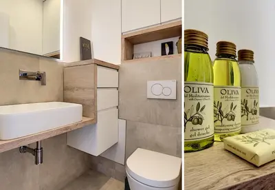 a bathroom with a sink and a toilet and a bottle of wine at Nestor&Jeeves - ALBERT 1ER DESIGN - Hyper center - Very close sea and pedestrian zone in Nice