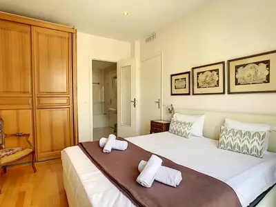 a bedroom with a large bed with two pillows on it at Nestor&Jeeves - OCEAN PROMENADE - Terrace with sea view - Spacious in Nice