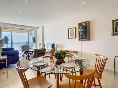 a dining room with a glass table and chairs at Nestor&Jeeves - OCEAN PROMENADE - Terrace with sea view - Spacious in Nice