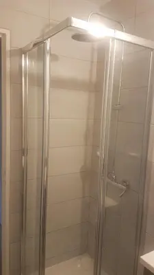 a shower with a glass door in a bathroom at NEW CHEAP PRIVATE ROOM, KITCHEN , OVERWIEUW sea,TRAM on spot, 12 minutes from nice train station with tram , beach in 17 min tram , CHAMBRE PRIVÉE pas cher, cuisine équipée , tram sur place, APERÇU mer, 12 min de la gare de Nice avec le tram, 17 min plage in Nice