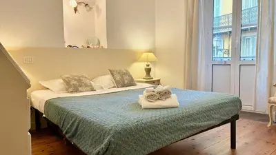 a bedroom with a bed with a towel on it at ApartHotel Riviera - JEAN JAURES 1 - Vieille Ville - Appartement de 3 pieces AC - 100m de la plage in Nice