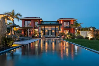 a large house with a swimming pool in front of it at Villa de luxe piscine vue mer in Nice
