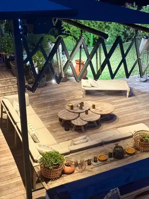 a view of a patio with a table and chairs at Villa de luxe piscine vue mer in Nice
