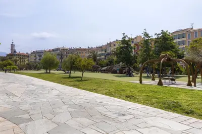 a park with a playground and buildings in the background at Vieux Nice - Jean Jaurès FSHH in Nice
