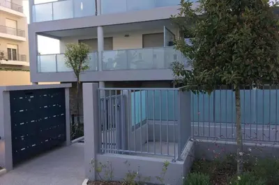 a apartment building with a balcony and a fence at Appartement à Nice in Nice