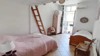 a bedroom with a bed and a tiled floor at Appartement 3 pièces ultra centre nice-ville in Nice