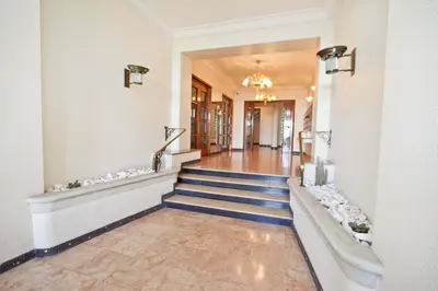 a hallway of a building with stairs and a lobby at Florida Sea Front in Nice