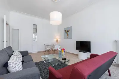 a living room with a couch and a tv at FEEL HOME - ASSALIT in Nice