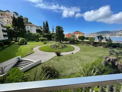 a view of a garden from a balcony at 3 Piéces confort climatisé vue mer, 4 personnes à Saint-Jean Cap Ferrat à proximité de monaco et menton in Saint-Jean-Cap-Ferrat