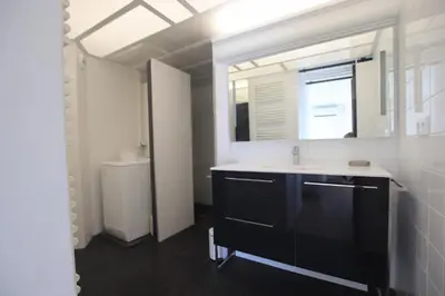 a bathroom with a sink and a mirror at La terrasse de Carras in Nice
