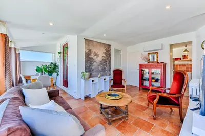 a living room with a couch and a table at La terrasse de Rossini in Nice