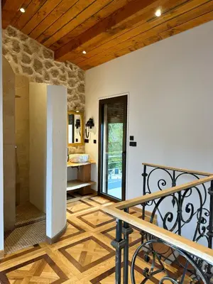 a room with a staircase leading to a bathroom at Escondida in Nice