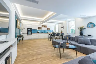 a living room with a couch and a table at Luxury 3 Bdr Garden & Parking - Angels' Garden in Nice