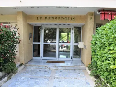 a front door of a building with a sign that reads le perropolis at Studio Cosy avec Terrasse et Parking, à 30m de la Mer, Cagnes-sur-Mer - FR-1-252A-56 in Cagnes-sur-Mer