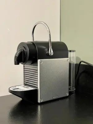 a small radio sitting on top of a table at Air-conditioned apartment with garage near the sea in Nice
