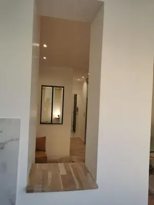 a view of a living room from the hallway at Halévy Résidence in Nice