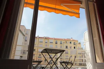 a window with a view of a building at Red studio Buffa in Nice