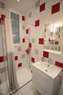 a white bathroom with a shower and a sink at Red studio Buffa in Nice