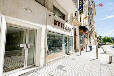 a street with a store on the side of a building at SUEDE 3 AP4209 By Riviera Holiday Homes in Nice