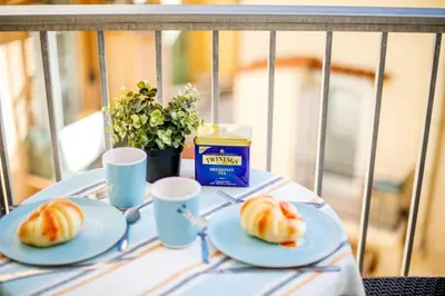 a table with two plates of croissants and a box of milk at SUEDE 3 AP4209 By Riviera Holiday Homes in Nice