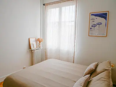 a bedroom with a bed and a window at Ker Riviera in Nice