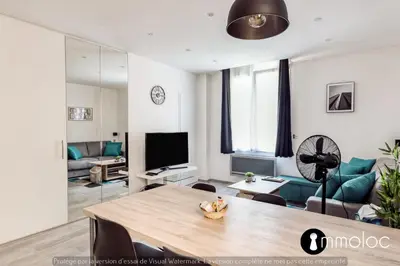 a living room with a table and a couch at Hyper central studio 2 minutes walk from 