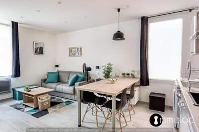 a living room with a table and a couch at Hyper central studio 2 minutes walk from 