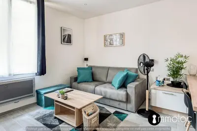 a living room with a couch and a table at Hyper central studio 2 minutes walk from 