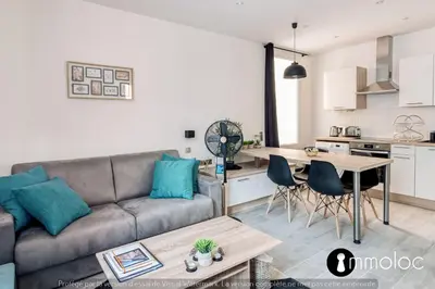 a living room with a couch and a table at Hyper central studio 2 minutes walk from 