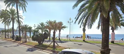 a hallway with a ceiling fan and a living room at Promenade des Anglais à côté du Negresco in Nice
