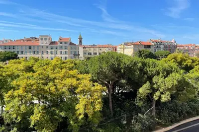 a large building with trees in front of a street at Spacious 3 BR flat Nice center - magnificent view in Nice